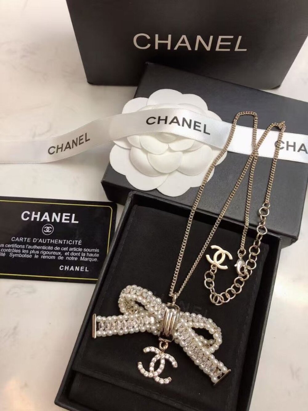 Chanel Gold Tone Pearl Crystal Bow Necklace